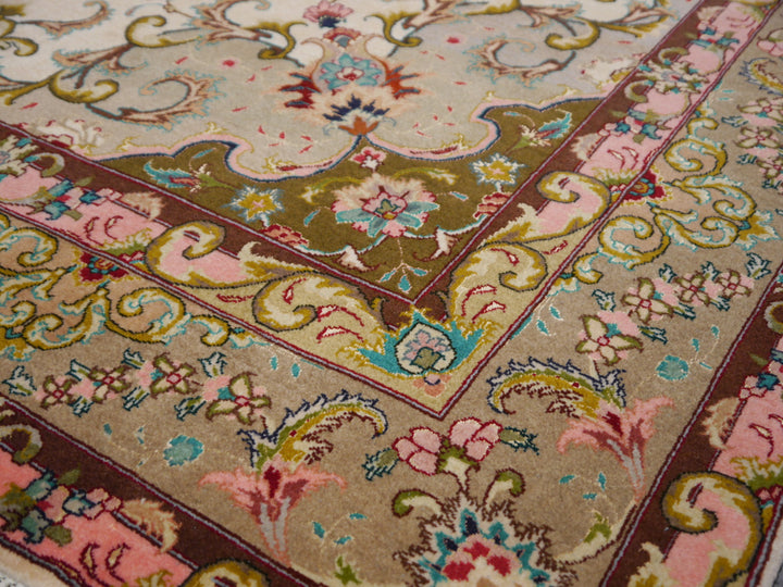 Luxurious Tabriz oriental rug in a living room setting, harmonious beige and green tones, elegant accent for high-end interiors.