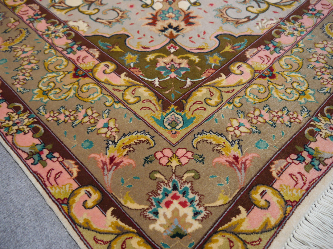 Tabriz Persian Rug Hand knotted 
Pile: Kurkwool (very fine lamb wool) and natural mulberry silk
Knot density: 50 raj / 324 kpsi / 490.000 knots per m²
Condition: New, unused
Age: 0 - 10 years
Collection: Traditional oriental rugs
Design: Medaillon
Size: Medium size accent rugs circa 7 x 5 ft 
Colors: Beige, Green, Red
Condition: Perfect
Rug Pad: Recommended
Care: Vaccum cleaning, proffesional rug washing if needed, no drycleaning or chemical cleaning.
Use: Goes well in Bedroom, Entry, Office, Livingroom