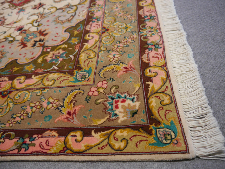 Tabriz Persian Rug Hand knotted 
Pile: Kurkwool (very fine lamb wool) and natural mulberry silk
Knot density: 50 raj / 324 kpsi / 490.000 knots per m²
Condition: New, unused
Age: 0 - 10 years
Collection: Traditional oriental rugs
Design: Medaillon
Size: Medium size accent rugs circa 7 x 5 ft 
Colors: Beige, Green, Red
Condition: Perfect
Rug Pad: Recommended
Care: Vaccum cleaning, proffesional rug washing if needed, no drycleaning or chemical cleaning.
Use: Goes well in Bedroom, Entry, Office, Livingroom