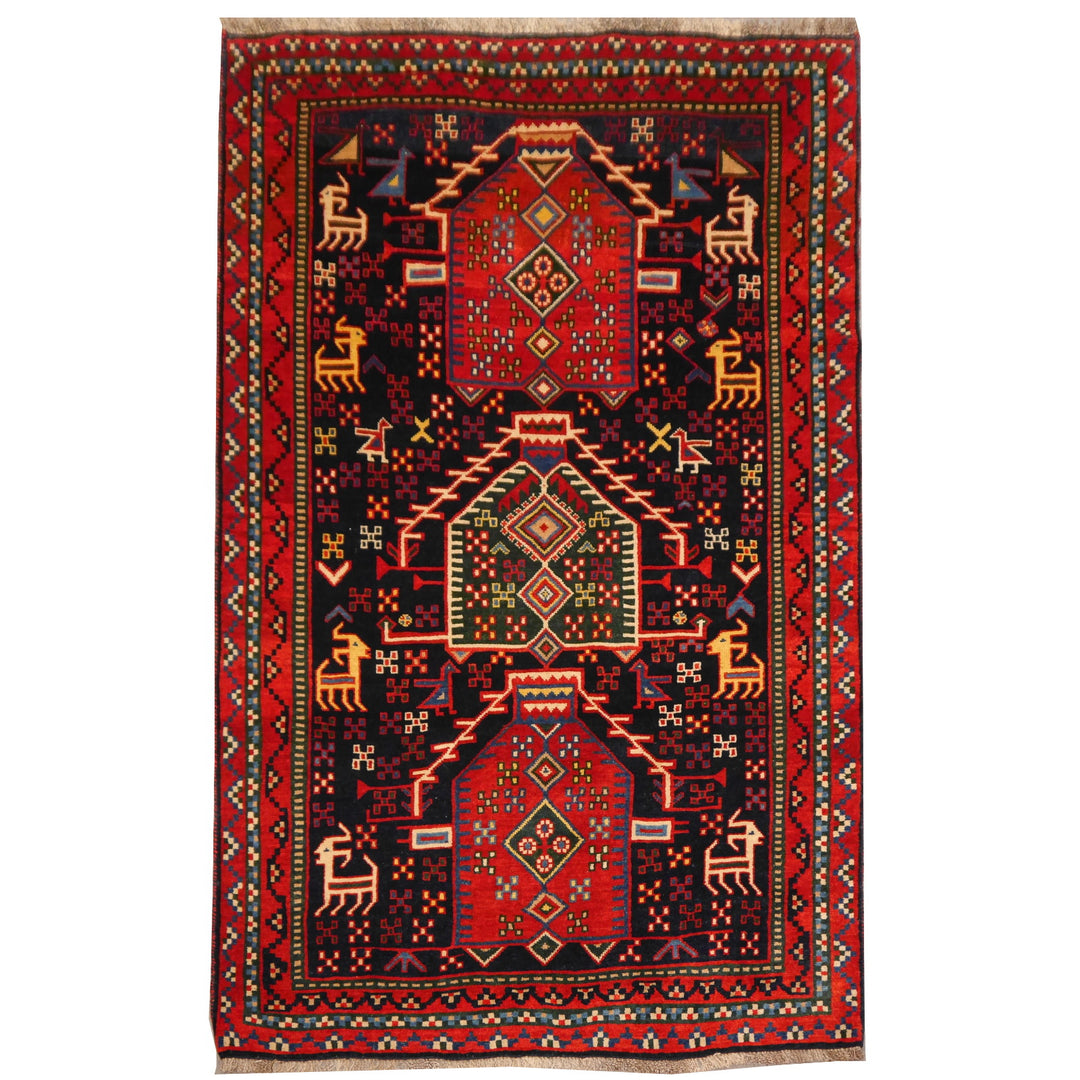 Loribaft Aghamiri Persian tribal rug from the Bakhtiari region of Iran, handspun wool, natural dyes, 247 × 165 cm, navy ground with red borders and animal motifs | Djoharian 13357