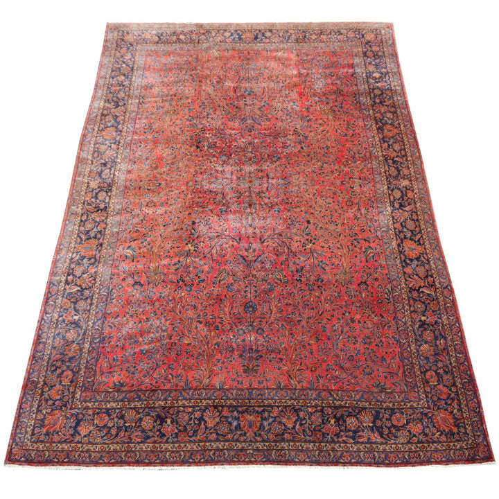 This distinguished Manchester Kashan represents a masterwork of classical Persian weaving traditions. Measuring 15 by 10 feet, this authentic antique exemplifies the refined craftsmanship synonymous with Kashan production, featuring intricate medallion designs and rich, harmonious colorways developed through traditional dyeing methods. As a US re-import, it carries documented provenance while offering collectors an exceptional opportunity to acquire a genuine piece of textile heritage. 