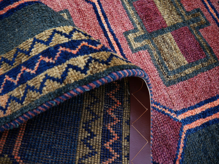 Authentic vintage Persian Luri rug with geometric tribal patterns in brick red and indigo blue, 197 x 132 cm. - Back and knots 01