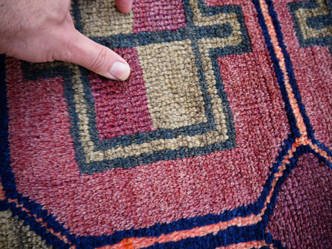 Authentic vintage Persian Luri rug with geometric tribal patterns in brick red and indigo blue, 197 x 132 cm. Pile Detail