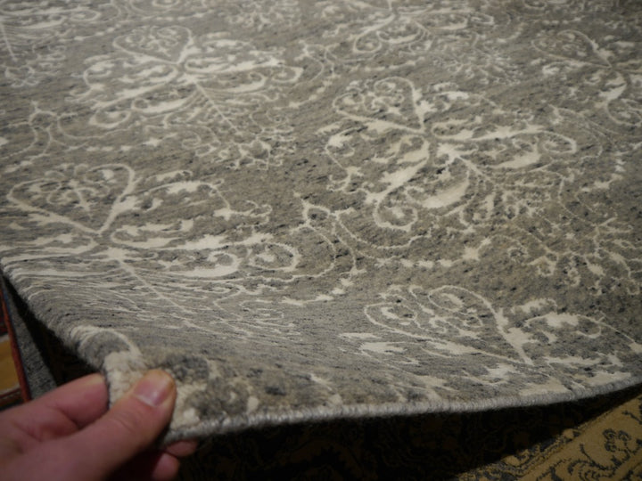 Ivory viscose motifs catching the light against the matte wool ground | 15745