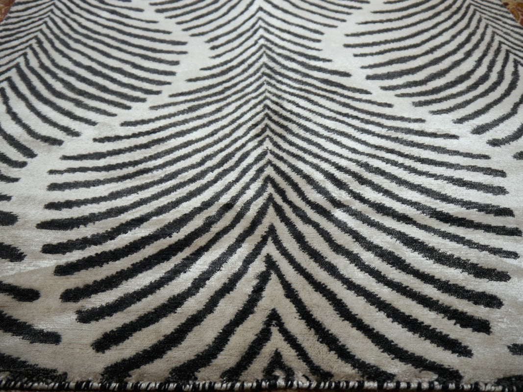 Edge of the Art Deco zebra rug with the pattern running to the rounded corner | 15756