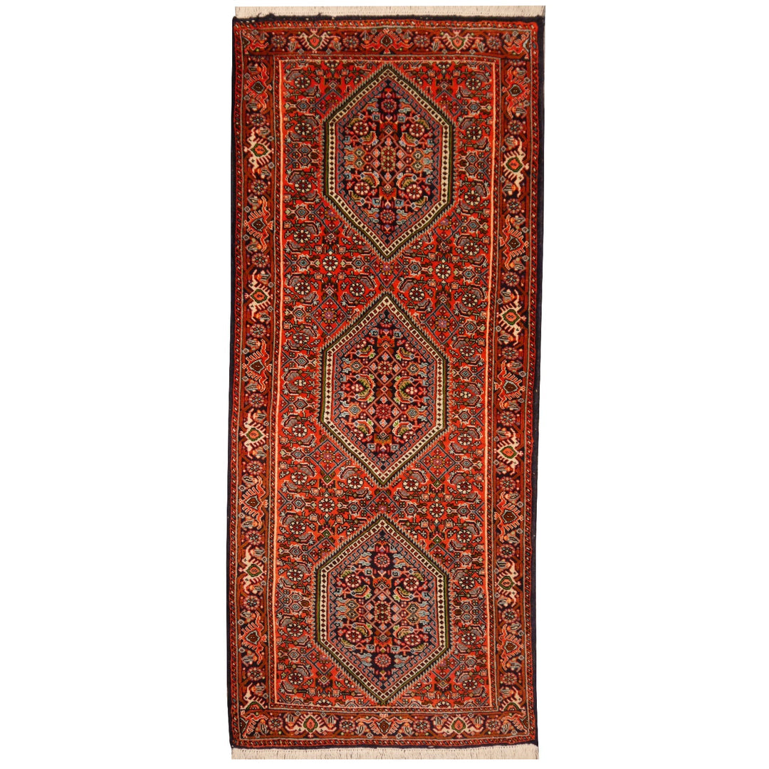 Tekab Bidjar runner rug, 147 × 62 cm, three navy hexagonal medallions on a tomato-red Herati field with ivory guard borders — full view