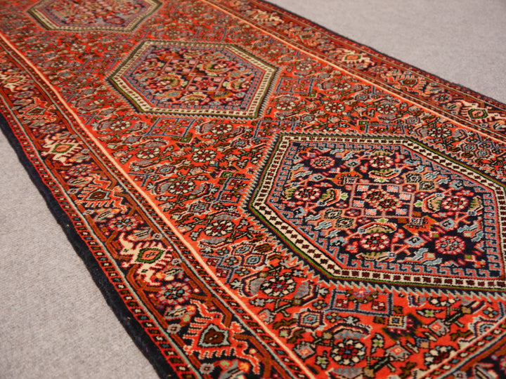 Angled view along the Tekab Bidjar runner showing all three medallions and the dense 12 mm new-wool pile